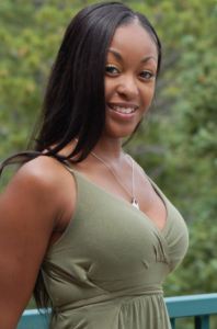 Woman in green dress smiling in Thorn Park, Zambia
